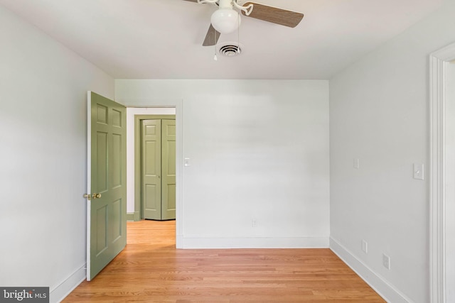 unfurnished room with ceiling fan and light hardwood / wood-style flooring