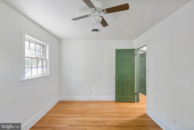 spare room featuring ceiling fan and wood-type flooring