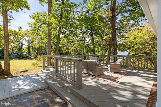 wooden deck featuring an outdoor hangout area