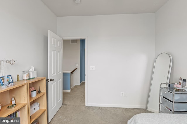 bedroom featuring light colored carpet