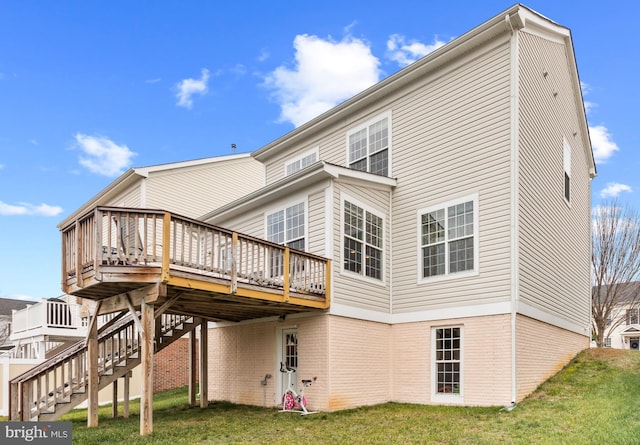 back of house with a yard and a wooden deck