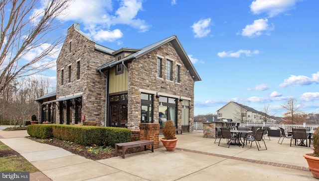 view of property exterior featuring a patio area