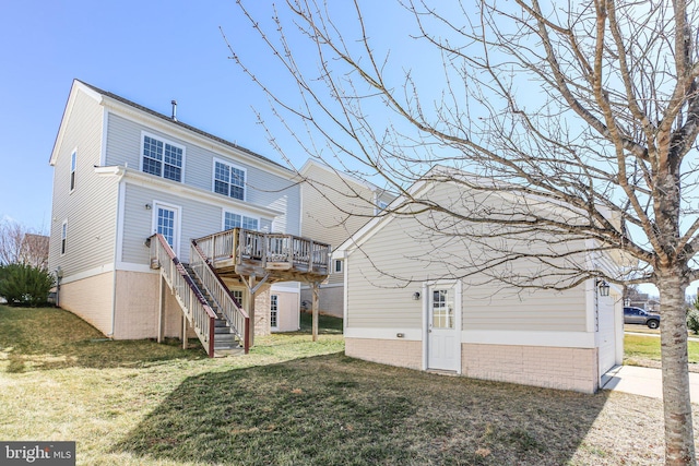 back of house featuring a yard and a wooden deck