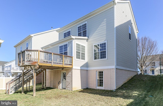 back of house with a yard and a wooden deck