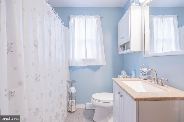 bathroom with toilet and vanity