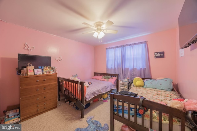 bedroom with ceiling fan and carpet flooring