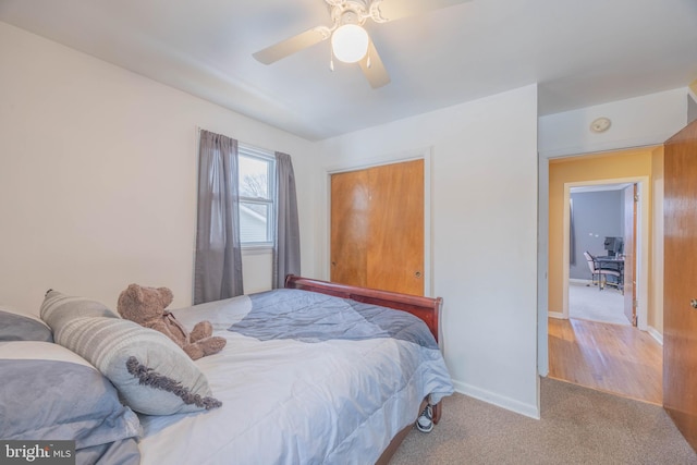 bedroom with light carpet and ceiling fan