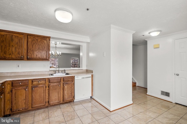 kitchen with crown molding, sink, white dishwasher, and decorative light fixtures