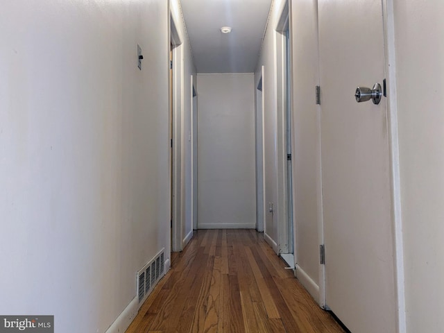 corridor featuring hardwood / wood-style floors