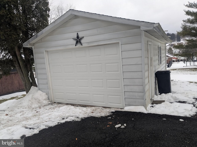 view of snow covered garage