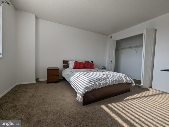 carpeted bedroom featuring a closet