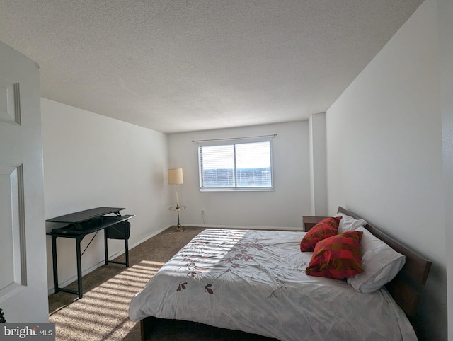 carpeted bedroom with a textured ceiling