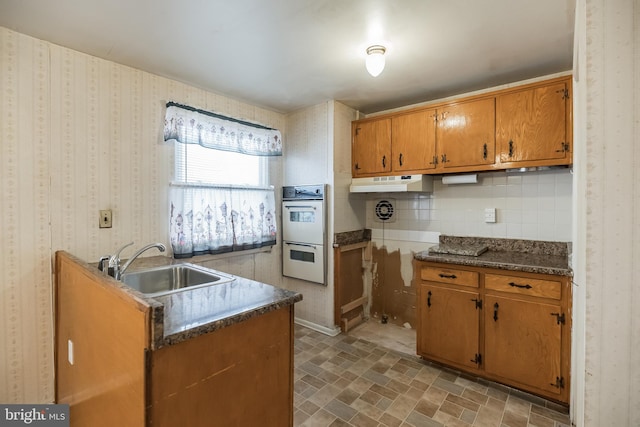 kitchen with sink and double oven