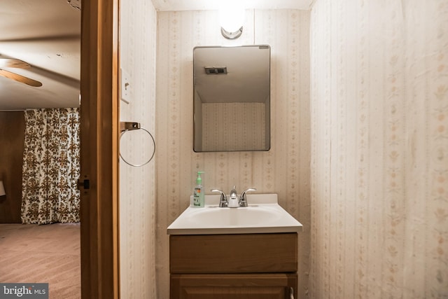 bathroom featuring vanity and ceiling fan