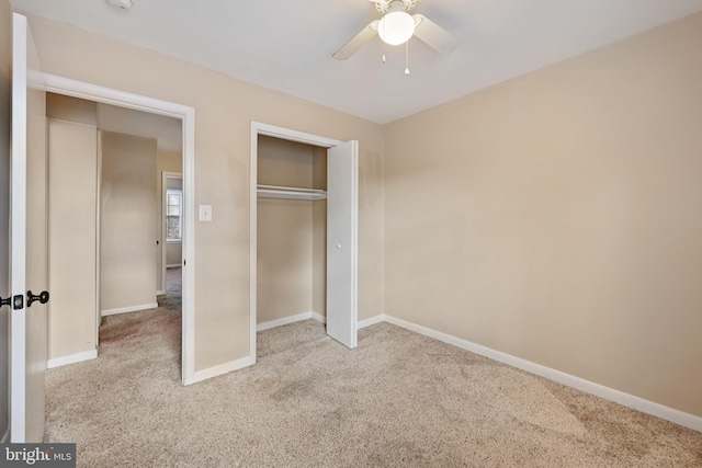 unfurnished bedroom with ceiling fan and light colored carpet