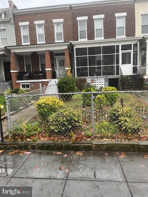 view of property with a sunroom