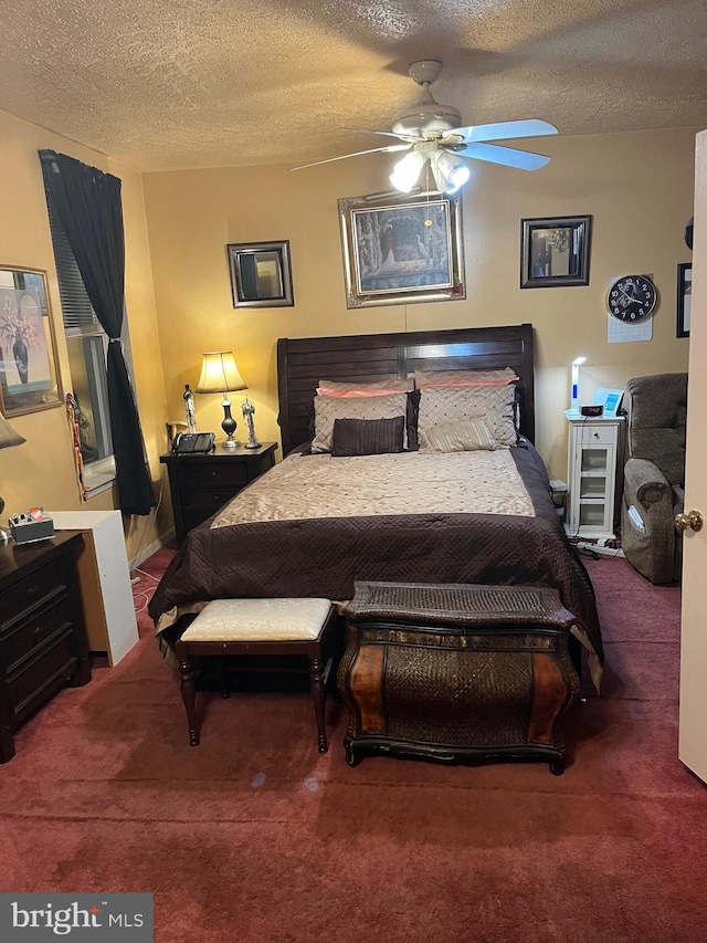 carpeted bedroom with ceiling fan and a textured ceiling