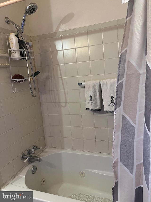 bathroom featuring shower / bathtub combination with curtain