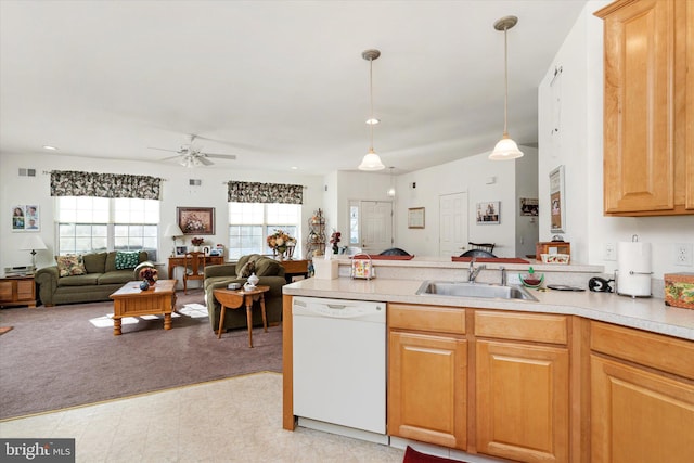 kitchen featuring decorative light fixtures, sink, a wealth of natural light, and dishwasher