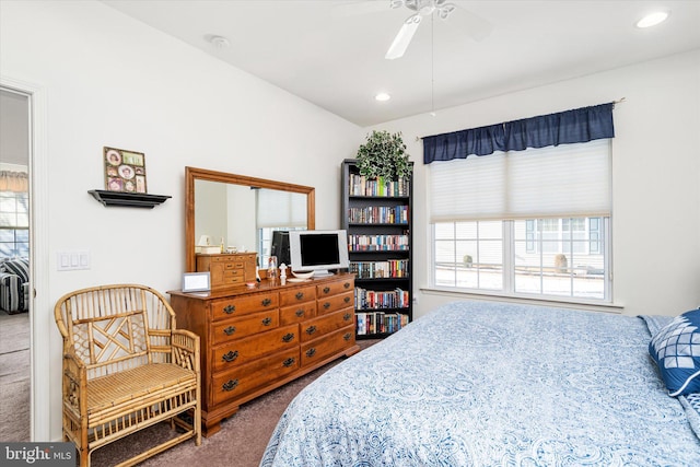 bedroom featuring ceiling fan and carpet