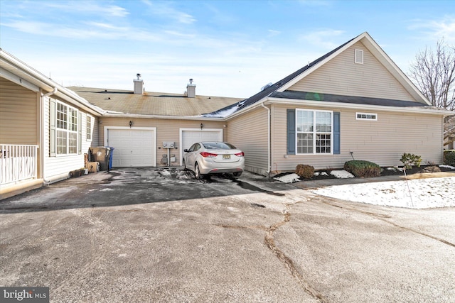 view of side of home featuring a garage