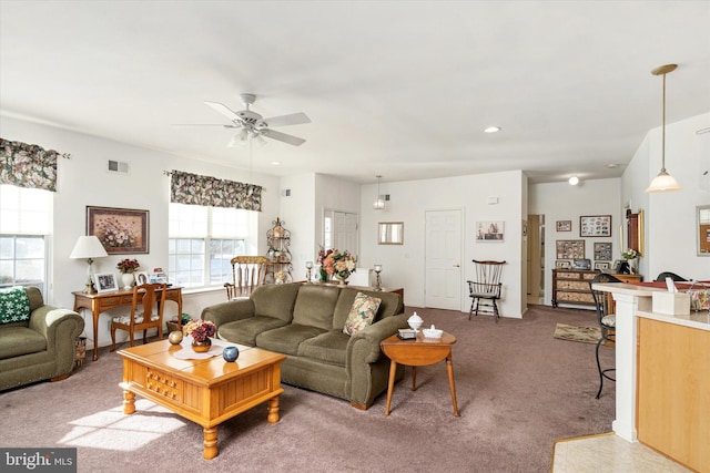 carpeted living room featuring ceiling fan