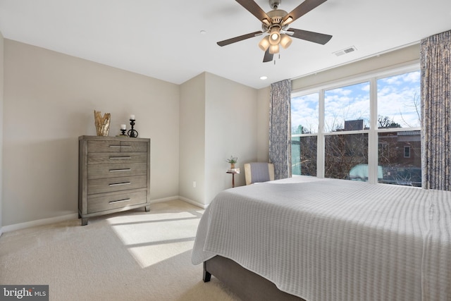 carpeted bedroom with ceiling fan