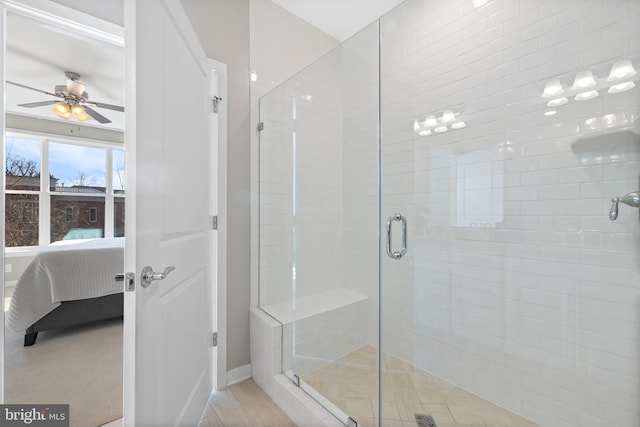 bathroom with ceiling fan and walk in shower