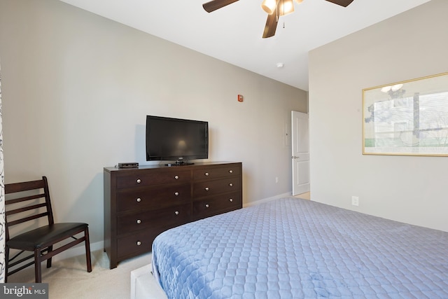 bedroom featuring light carpet and ceiling fan