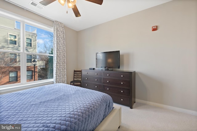 bedroom with light colored carpet and ceiling fan