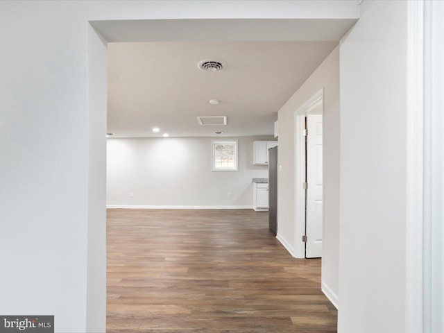 hall with hardwood / wood-style floors