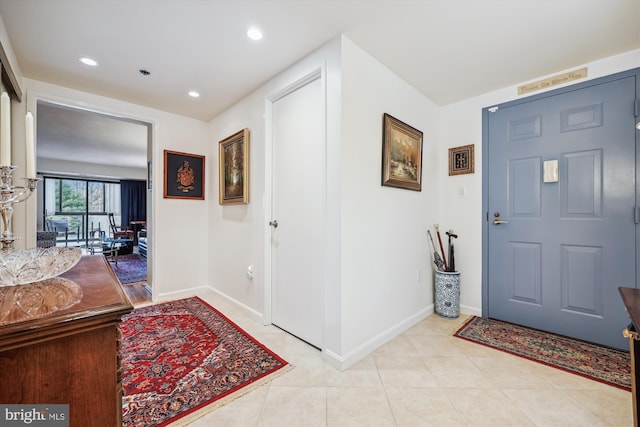 foyer with light tile patterned flooring