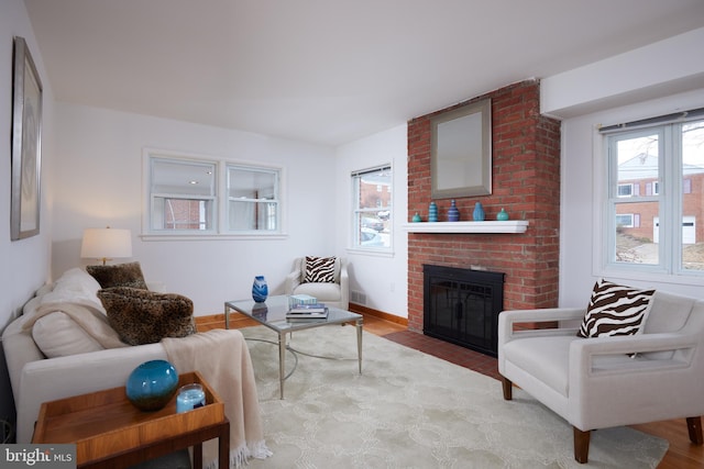 living room with a brick fireplace