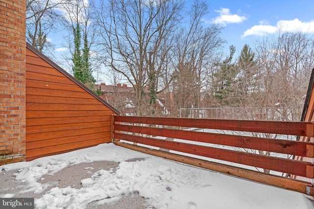 view of yard layered in snow