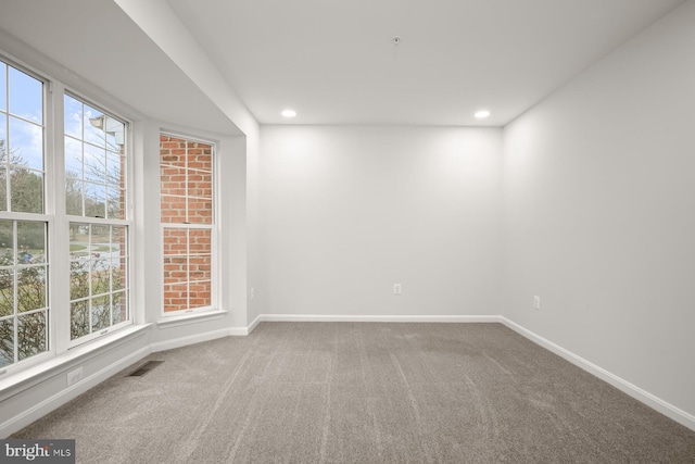 unfurnished room with carpet flooring