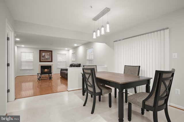 dining room featuring light hardwood / wood-style flooring and an inviting chandelier