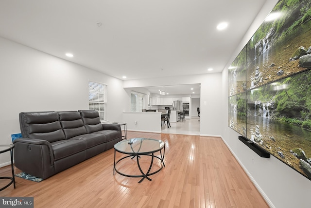 living room with light hardwood / wood-style flooring