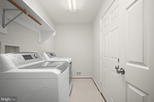 laundry area with washer and clothes dryer