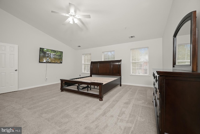 bedroom with ceiling fan, light colored carpet, and lofted ceiling