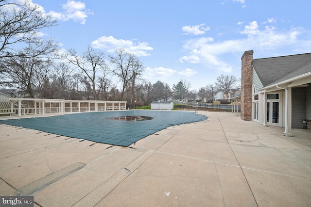 view of swimming pool featuring a patio