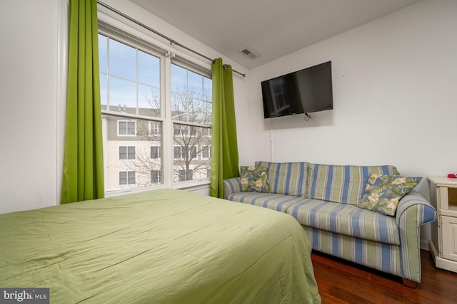 bedroom featuring dark hardwood / wood-style flooring