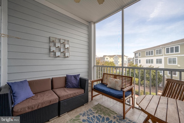 sunroom with a wealth of natural light and ceiling fan