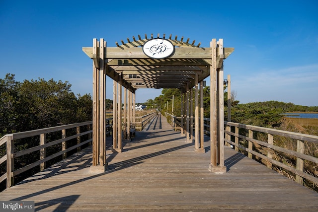 view of dock with a pergola