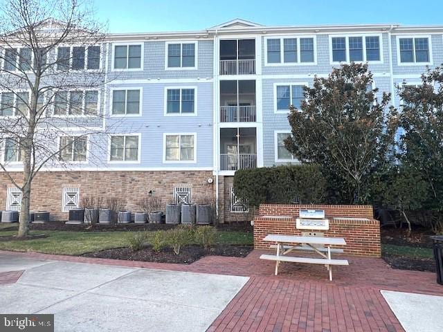 view of building exterior with cooling unit