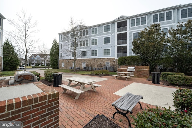 surrounding community featuring a patio area