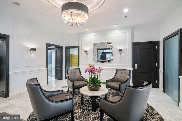 living room featuring a notable chandelier and crown molding