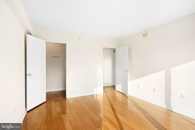 interior space with a closet and hardwood / wood-style floors