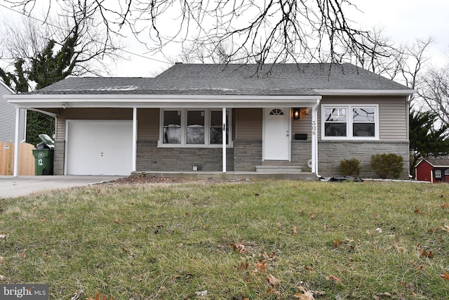 ranch-style home with a front yard and a garage