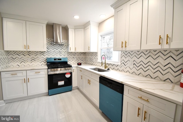 kitchen with white cabinetry, sink, wall chimney exhaust hood, light stone countertops, and appliances with stainless steel finishes