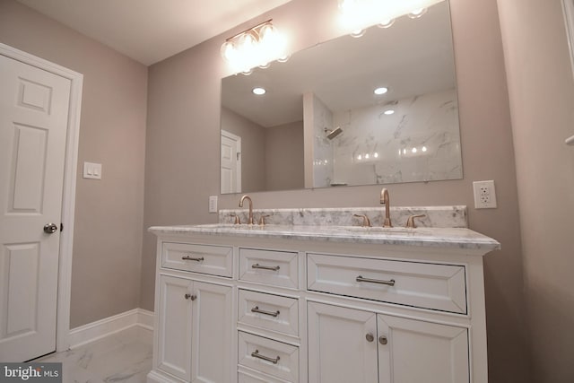 bathroom with a shower and vanity